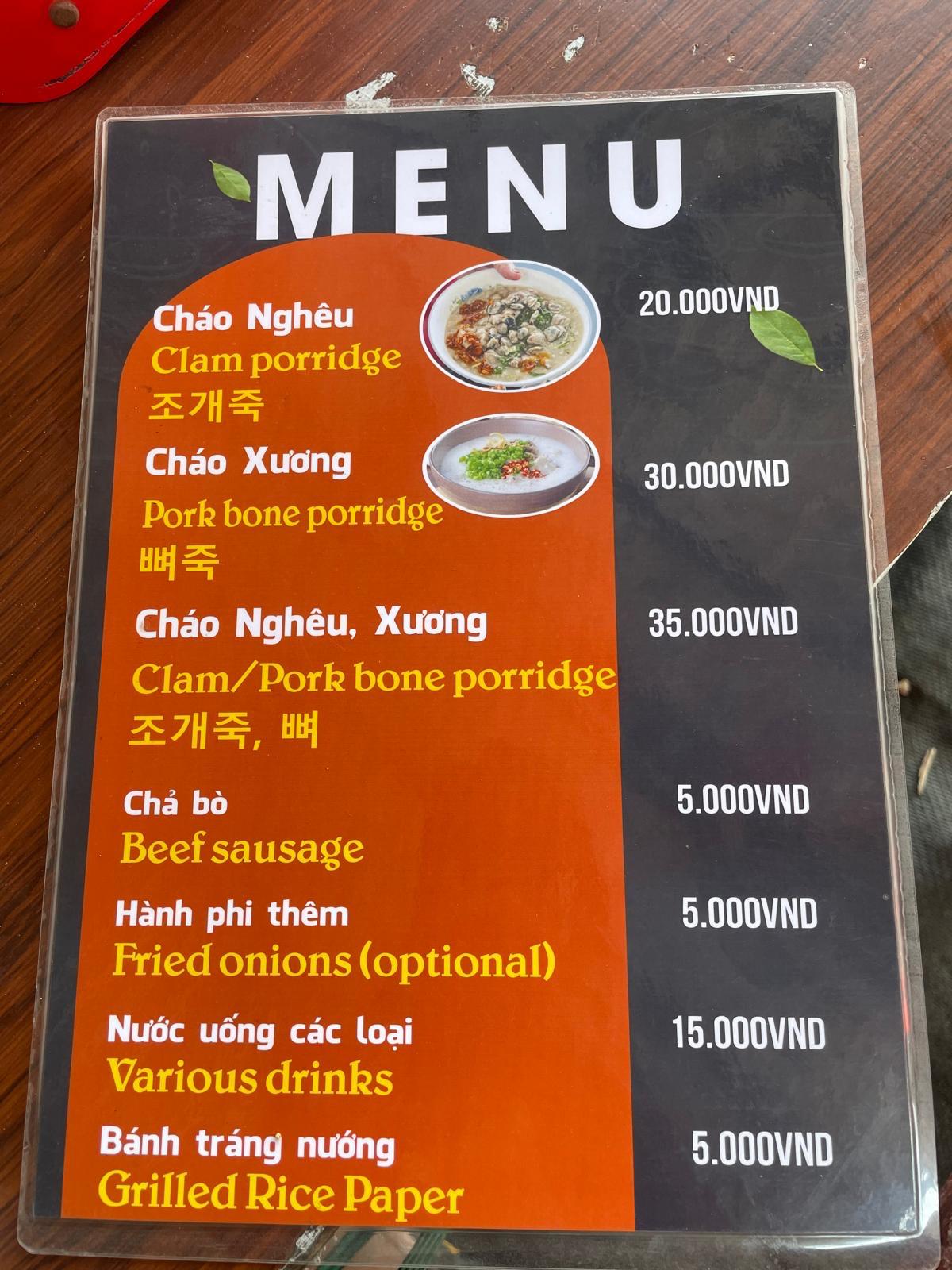A black and orange local menu board